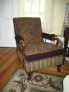 Wooden arm chair with seat cushion