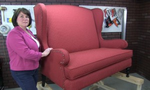 Kimberley Chagnon with fully reupholstered Wingback Settee that was video taped for a future upholstery classes.