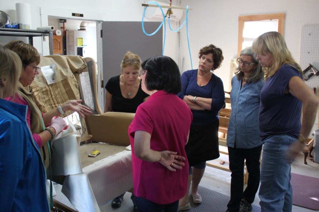 Answering questions during our hands-on upholstery workshop