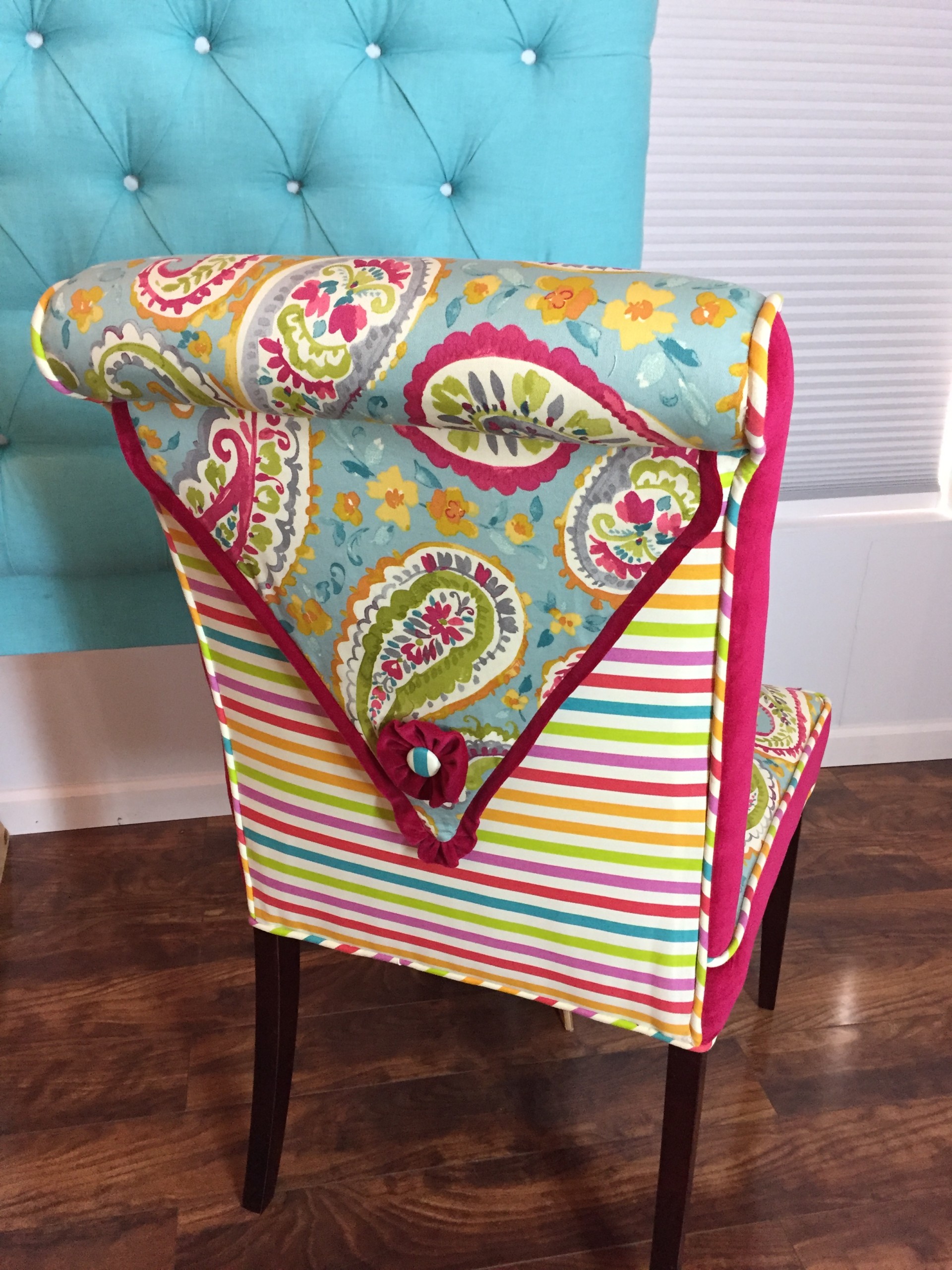 pink striped and whimsy fabric on upholstered chair
