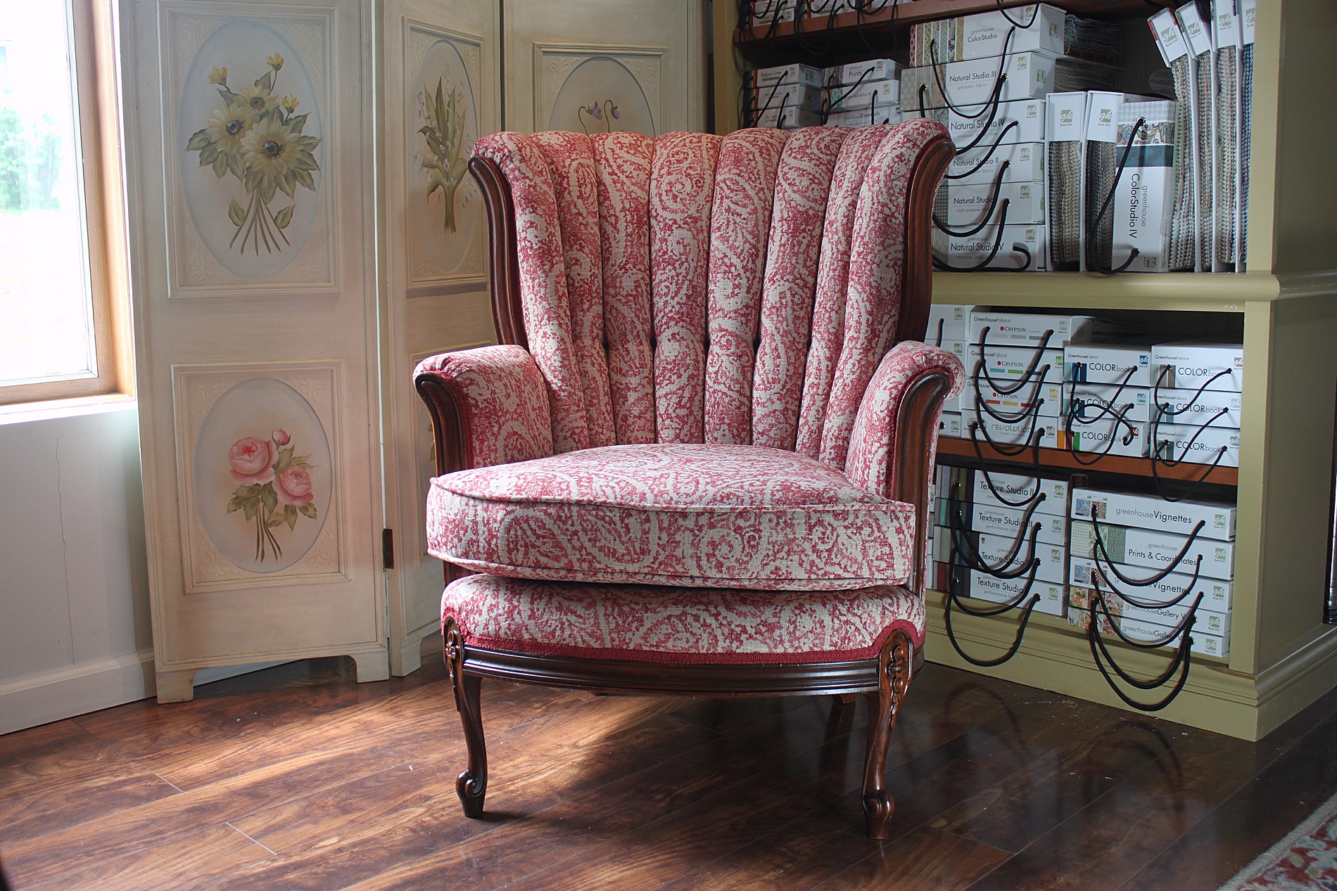 red paisley reupholstered chair