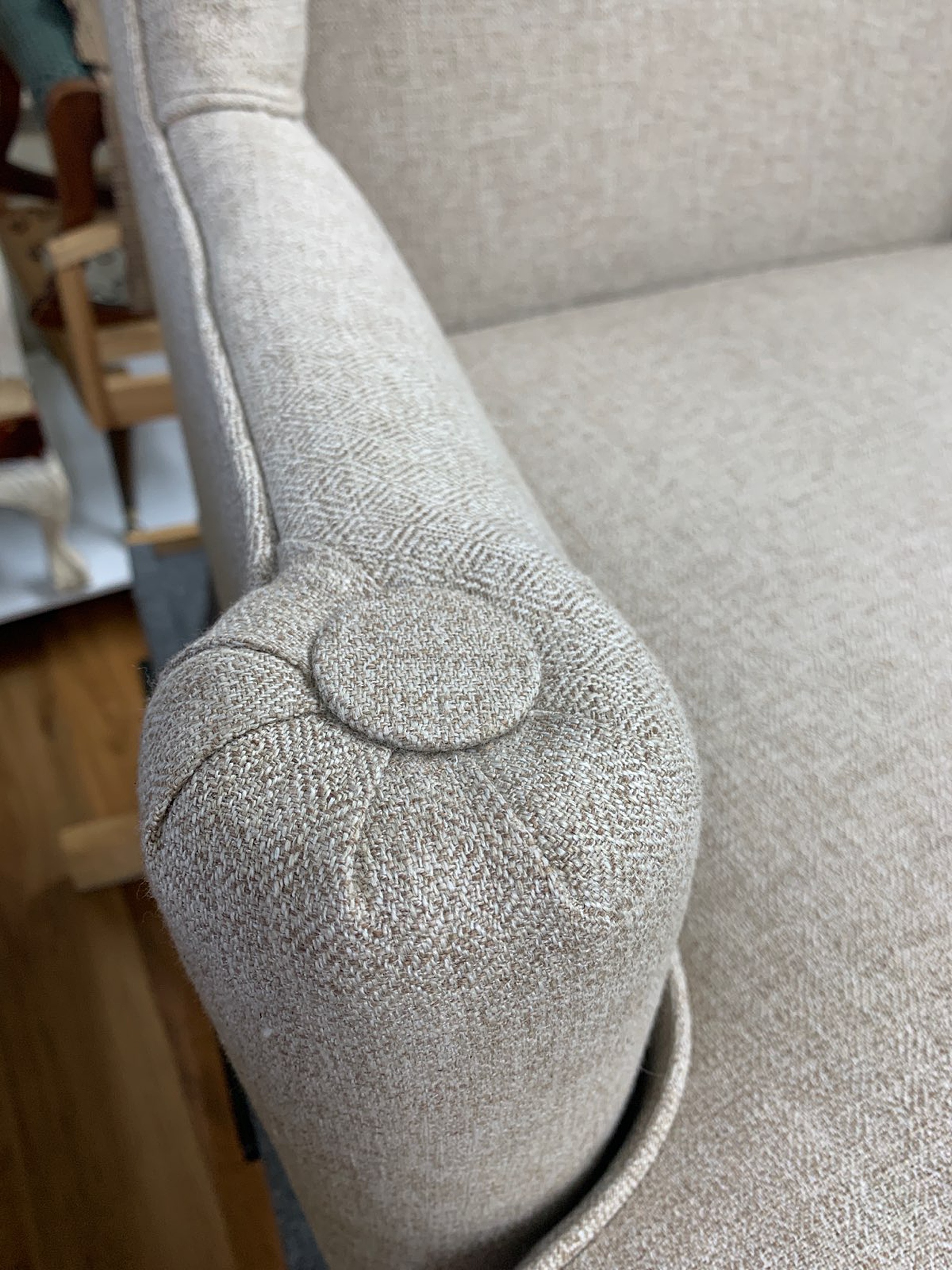decorative buttons and details on reupholstered chair