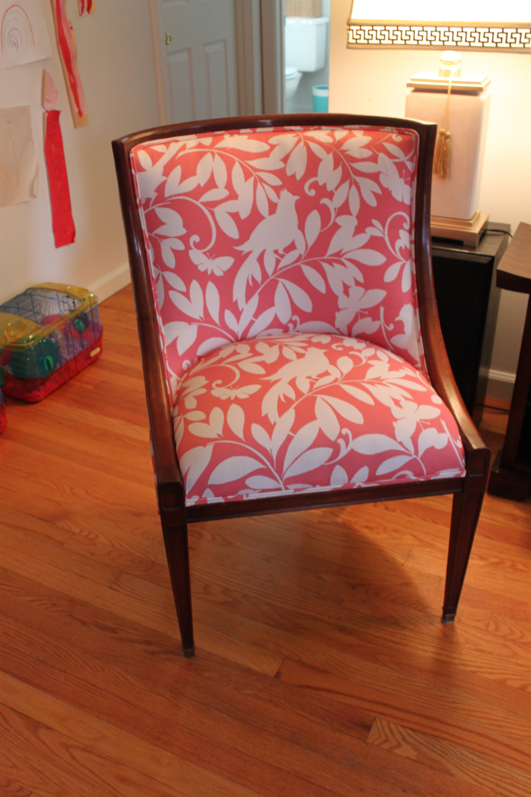 pink and white upholstered chair | performing upholstery client work