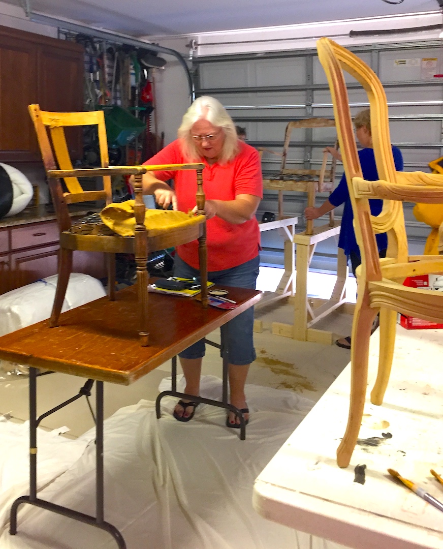 reupholstering a chair during workshop