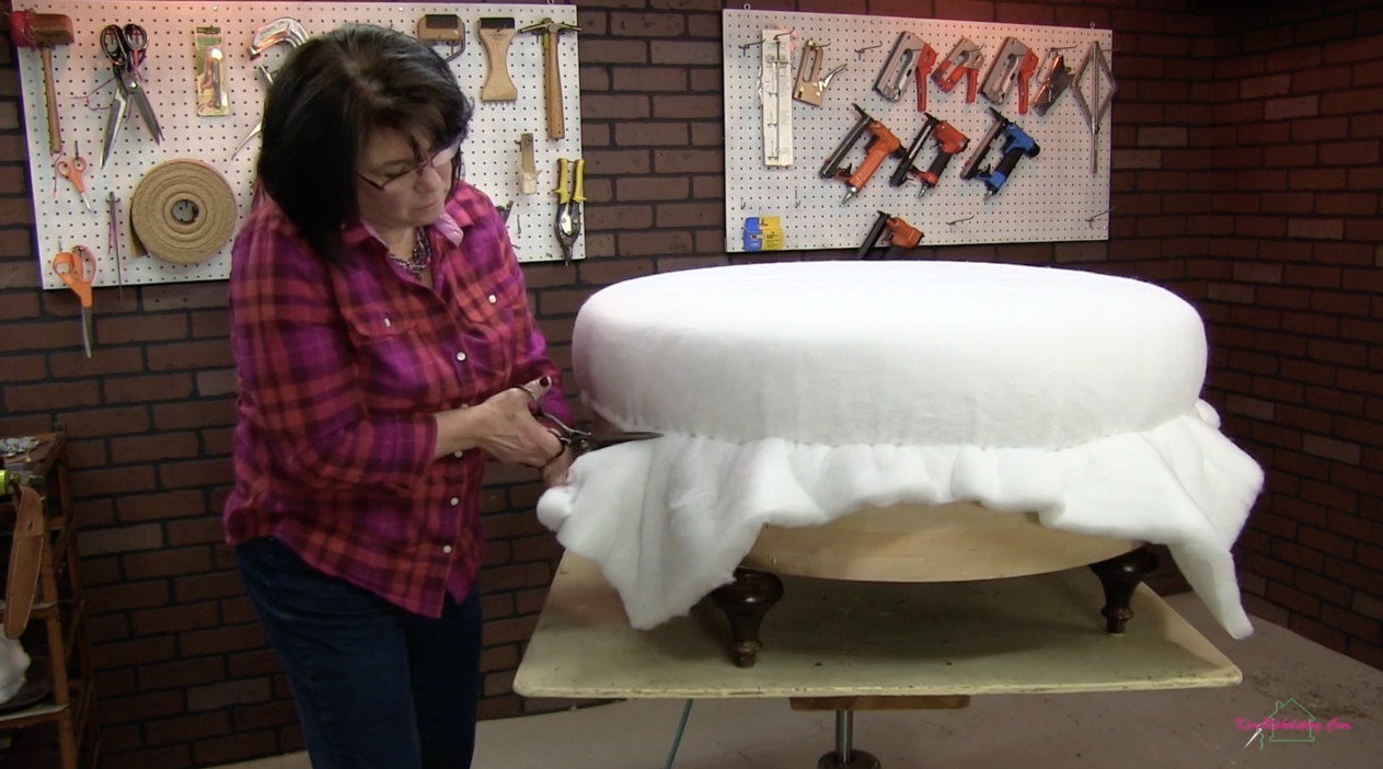 Attaching a layer of Dacron for this DIY round ottoman